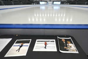 Photographs of aircraft crash victims from The Skating Club of Boston rink are displayed rink side on Thursday in Norwood, Massachusetts. From left is skater Jinna Han, skater Spencer Lane and coaches Vadim Naumov and Evgenia Shishkova. (AP Photo/Charles Krupa)