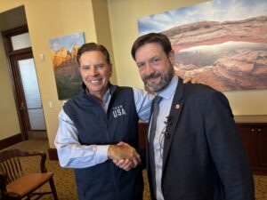 Fraser Bullock, President and Chief Executive Officer for the Salt Lake City-Utah Committee for the Games, greets Fabrice Pannekoucke, president of the Auvergne-Rhône-Alpes, one of the regions for the French Alps 2030 Olympic and Paralympic Winter Games, during a trade mission meeting on Thursday in Salt Lake City. Photo by Matt Traub/SportsTravel