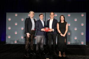 (Left to right) Kevin Demoff, President, LA Rams, Peter O'Reilly, EVP International, Major Events and Club Business at the NFL, Steve Dimopoulos, Victoria's Minister for Tourism, Sport and Major Events, and Charlotte Offord, General Manager, NFL Australia & New Zealand, pose for a photo after announcing the 2026 NFL Melbourne Game on Wednesday at Ernest N. Morial Convention Center in New Orleans. (Doug Benc/AP Content Services for the NFL)